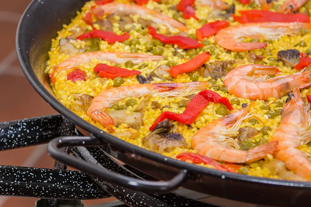 traditional spanish paella cooked in a pan 2021 09 03 07 04 46 utc